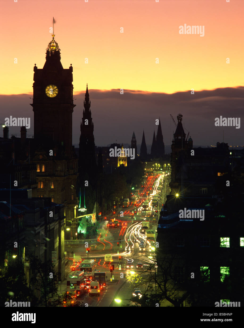 Aerial view over Princes Street at dusk, including the silhouetted Waverley Hotel clock tower, Edinburgh, Lothian, Scotland, UK Stock Photo