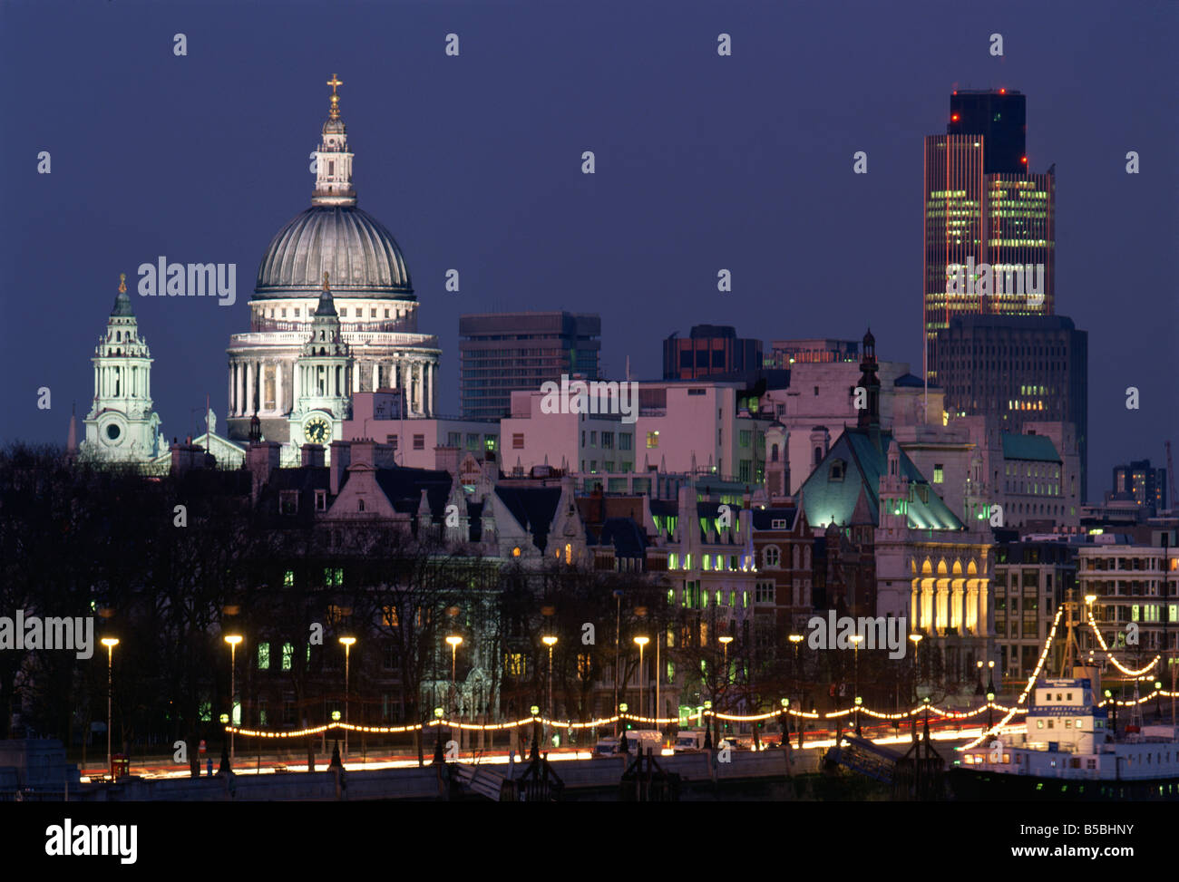 City skyline, including St.Paul's Cathedral and the NatWest Tower, from across the Thames at dusk, London, England, UK Stock Photo