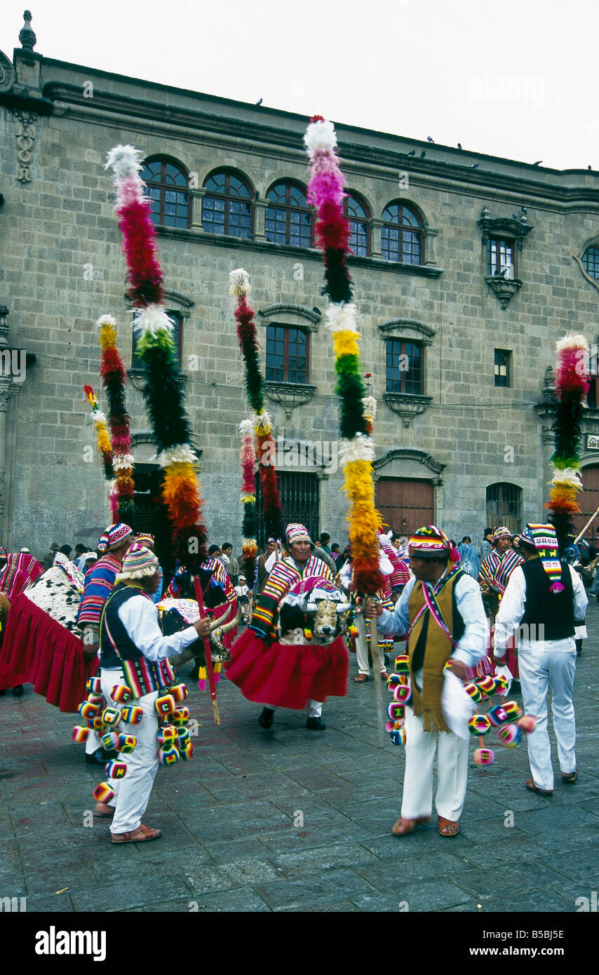 City Festival parade People dressed in traditional costumes hats Bright colours Person with bull head LA PAZ BOLIVIA Stock Photo