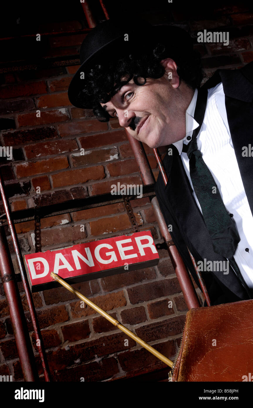 Charlie Chaplin pointing at Danger sign Stock Photo