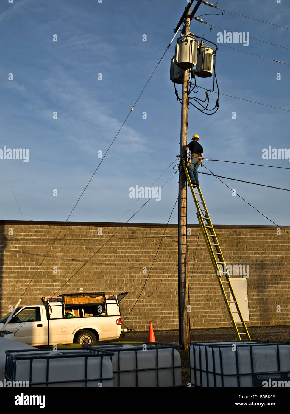 Telephone Utility line man on the working on the pole Stock Photo Alamy