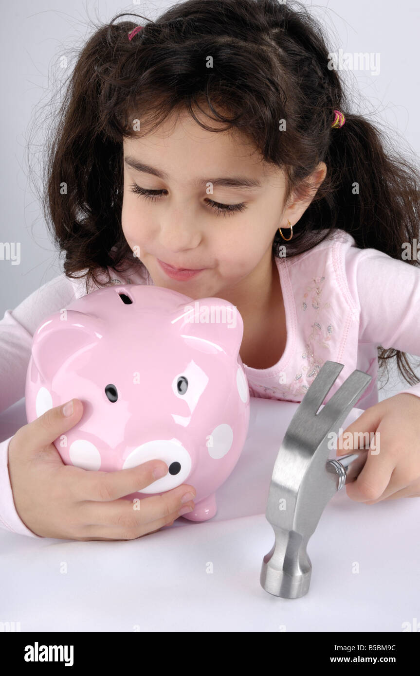 Young girl with a piggy bank Stock Photo