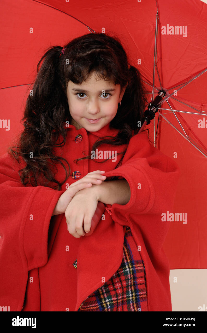 Portrait of a girl in a red coat Stock Photo Alamy