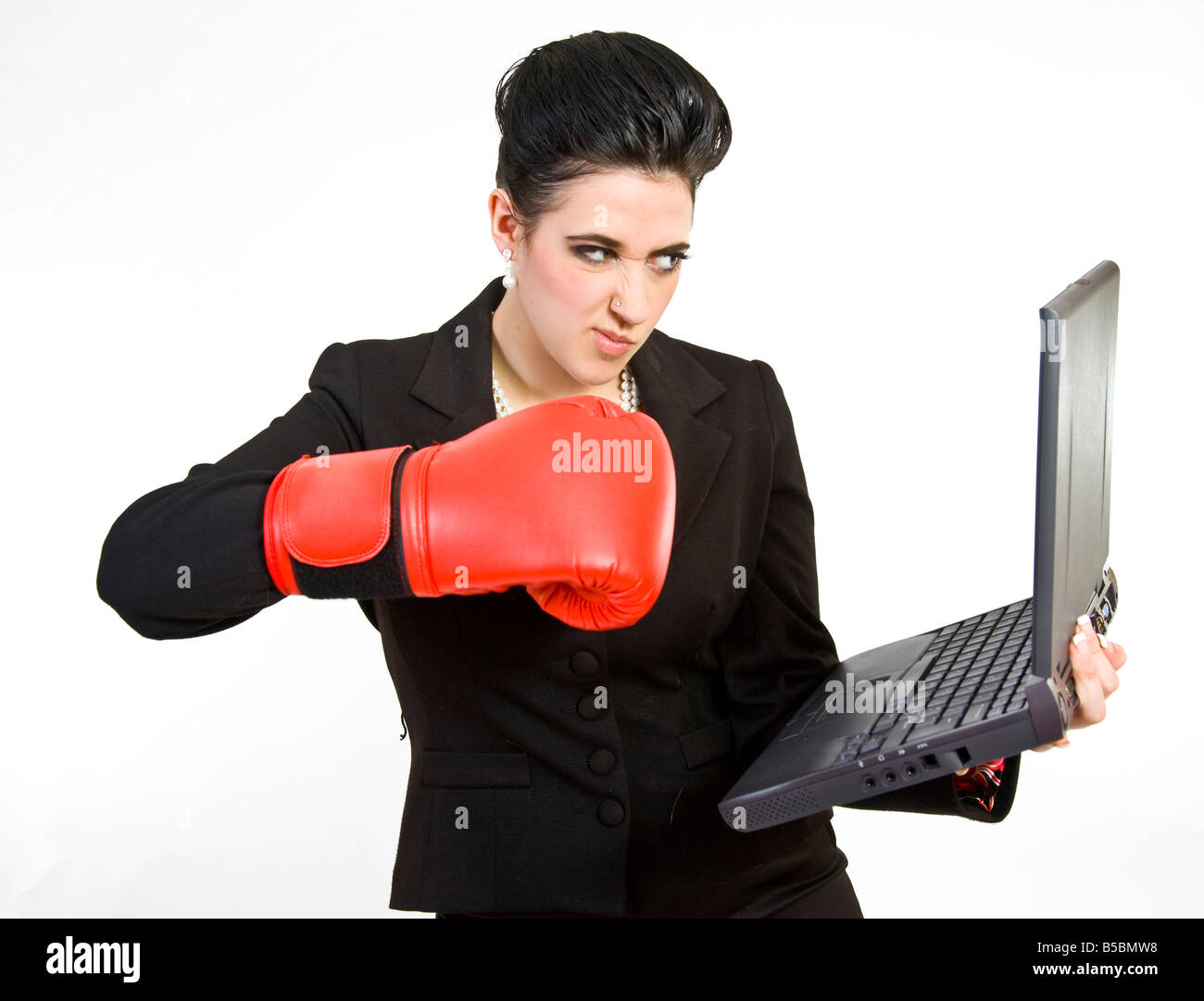 Business woman punching a laptop with a boxing glove Stock Photo - Alamy