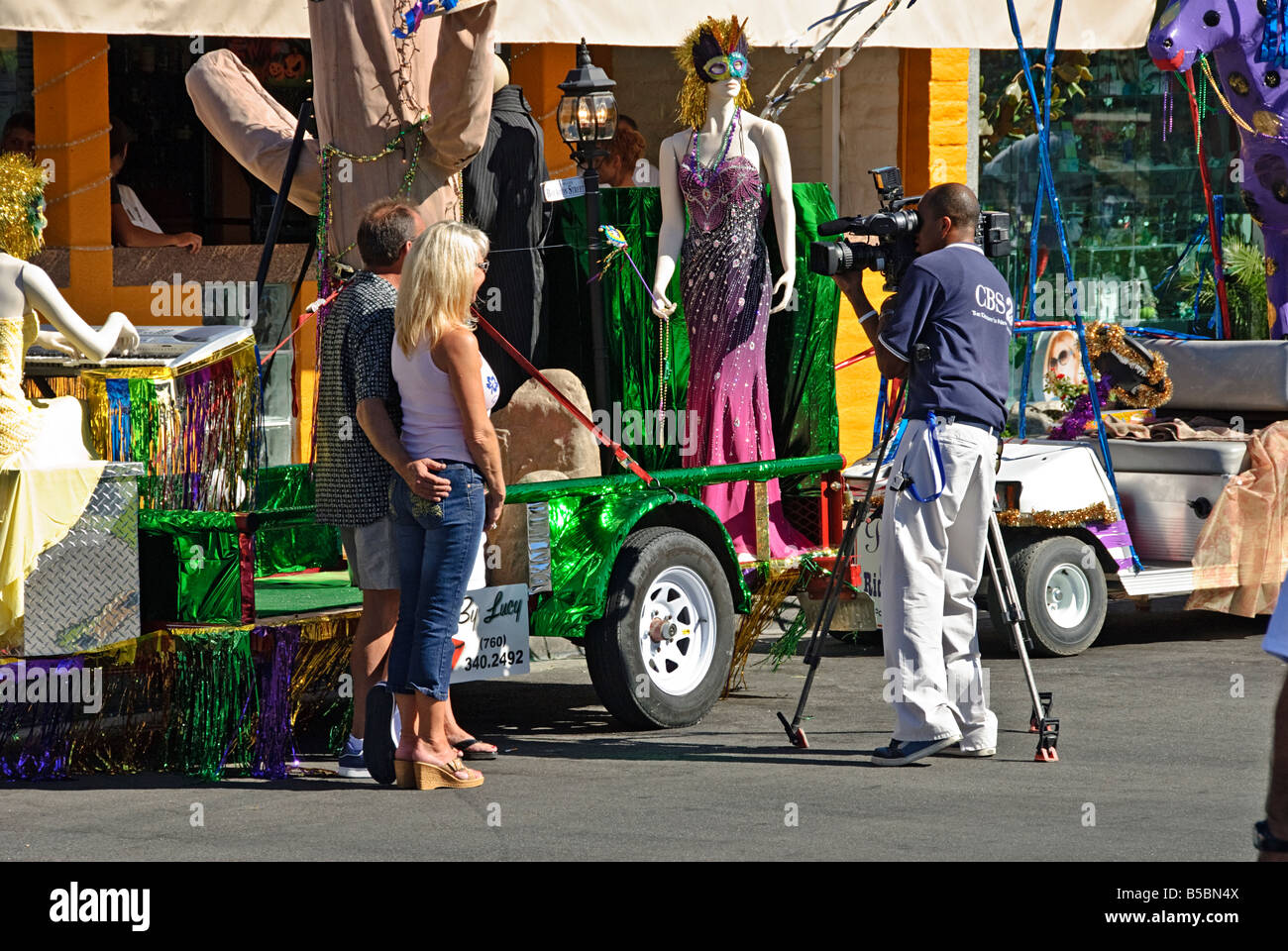 Palm Desert CA Golf Cart Parade 'Mardi Gras Desert Style' decorated golf carts spectacular color, Golf buggy, TV interview Stock Photo