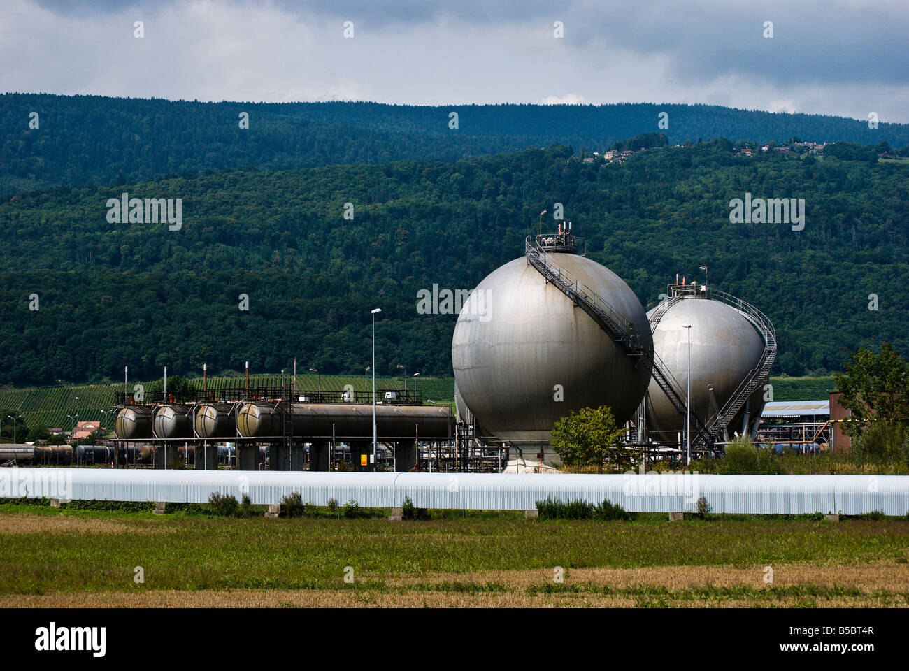 Spherical storage tanks at a refinery near Cornaux Switzerland Stock Photo