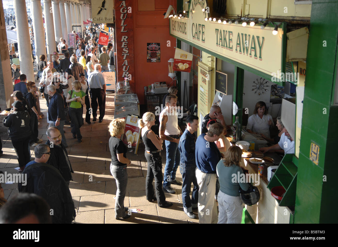 People buying fish and chips from the Madiera cafe on Brighton seafront