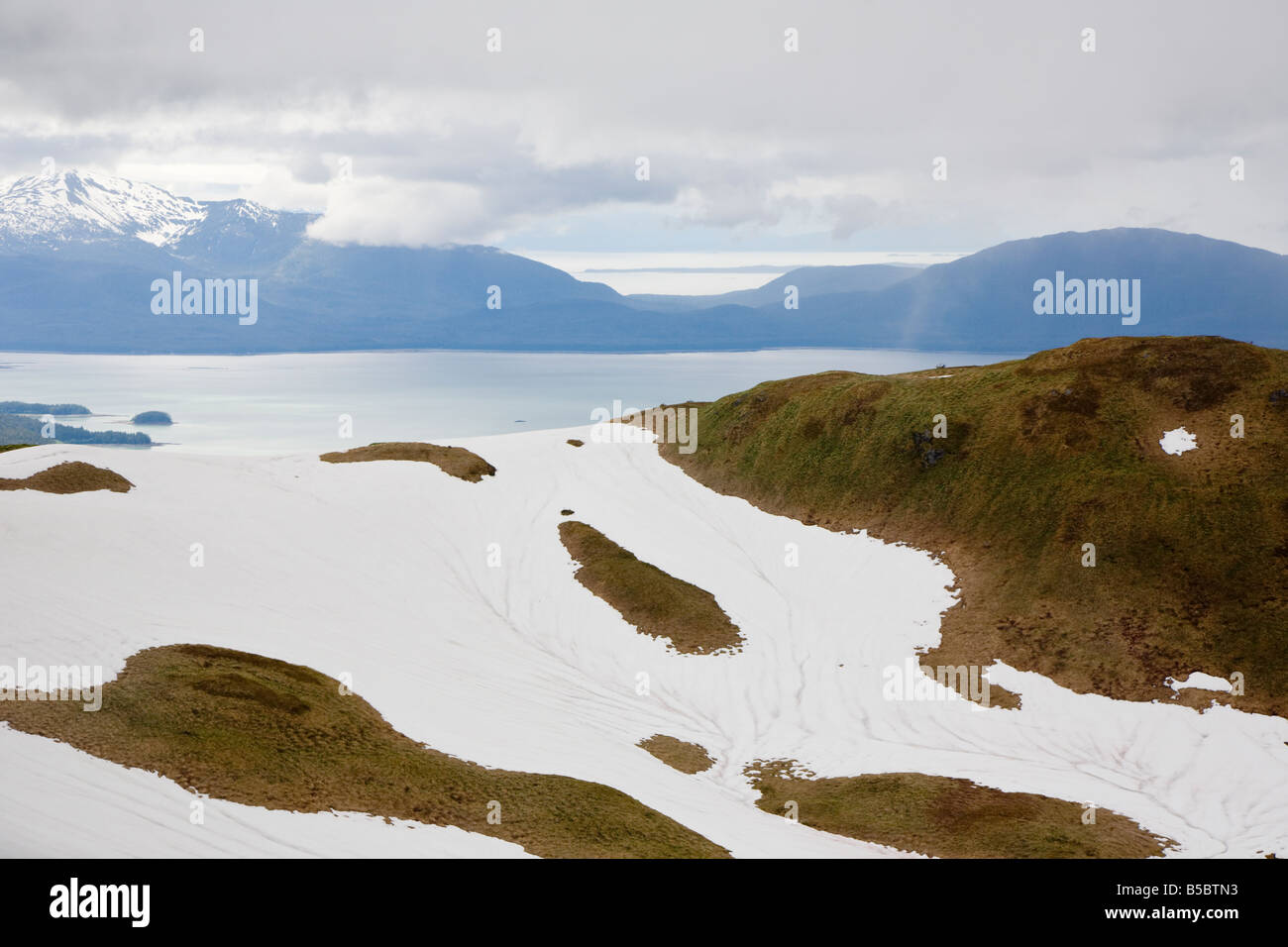 Aerial view of snow capped mountains above Juneau, Alaska Stock Photo