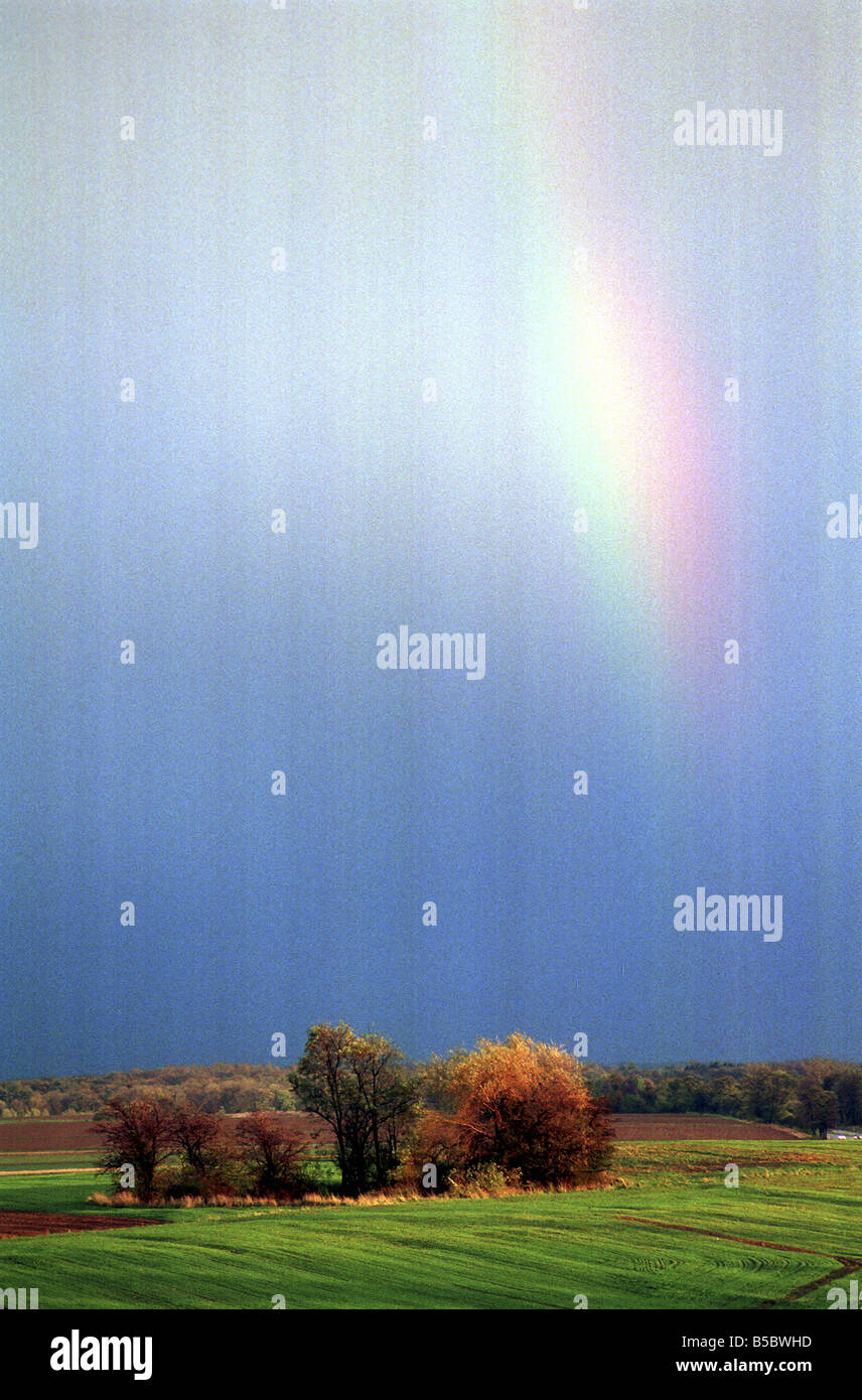 Rural landscape and rainy sky with rainbow Stock Photo - Alamy
