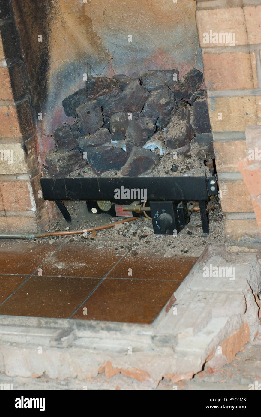 condemed Coal effect gas fire with soot and blocked chimney Stock Photo
