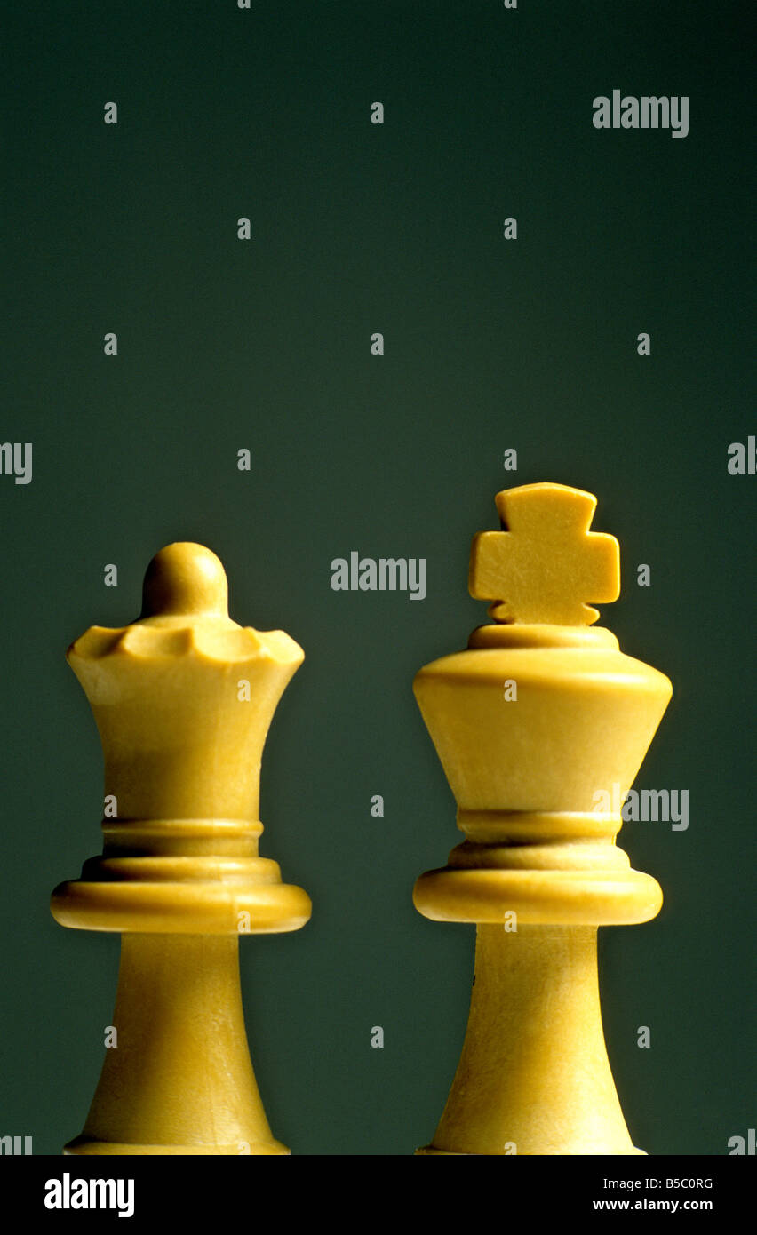 Queen and king chess pieces on white background Stock Photo - Alamy