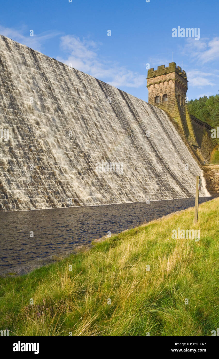 Dam wall with water overflowing Ladybower reservoir Derbyshire Peak district national park Derbyshire England UK GB EU Europe Stock Photo