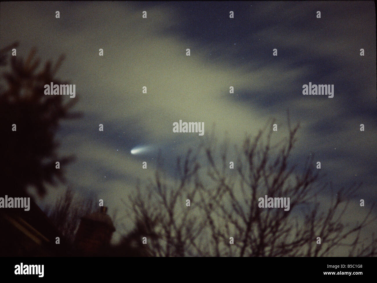 Comet Hale Bopp seen through clouds Stock Photo