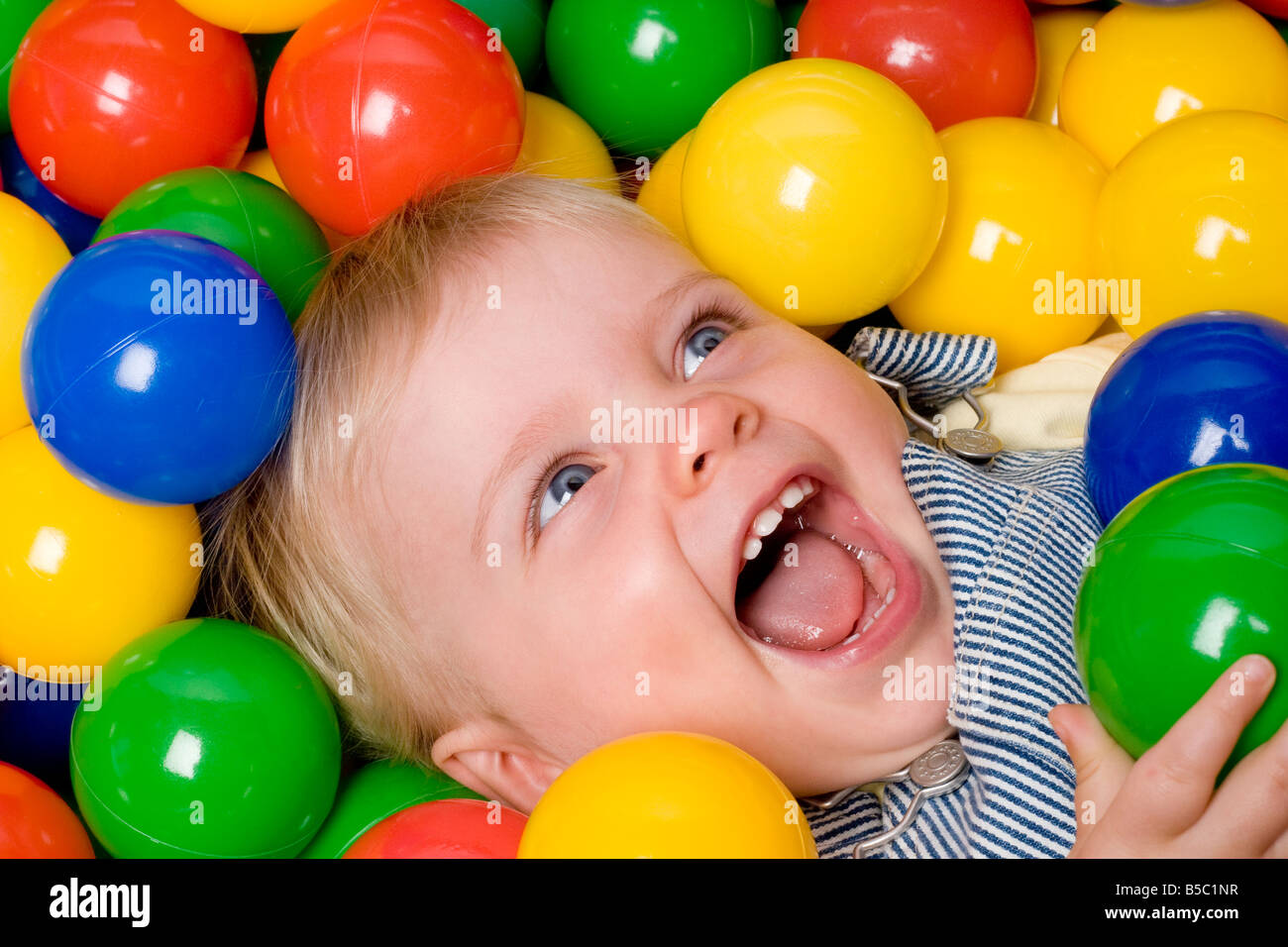 kid in ball pit