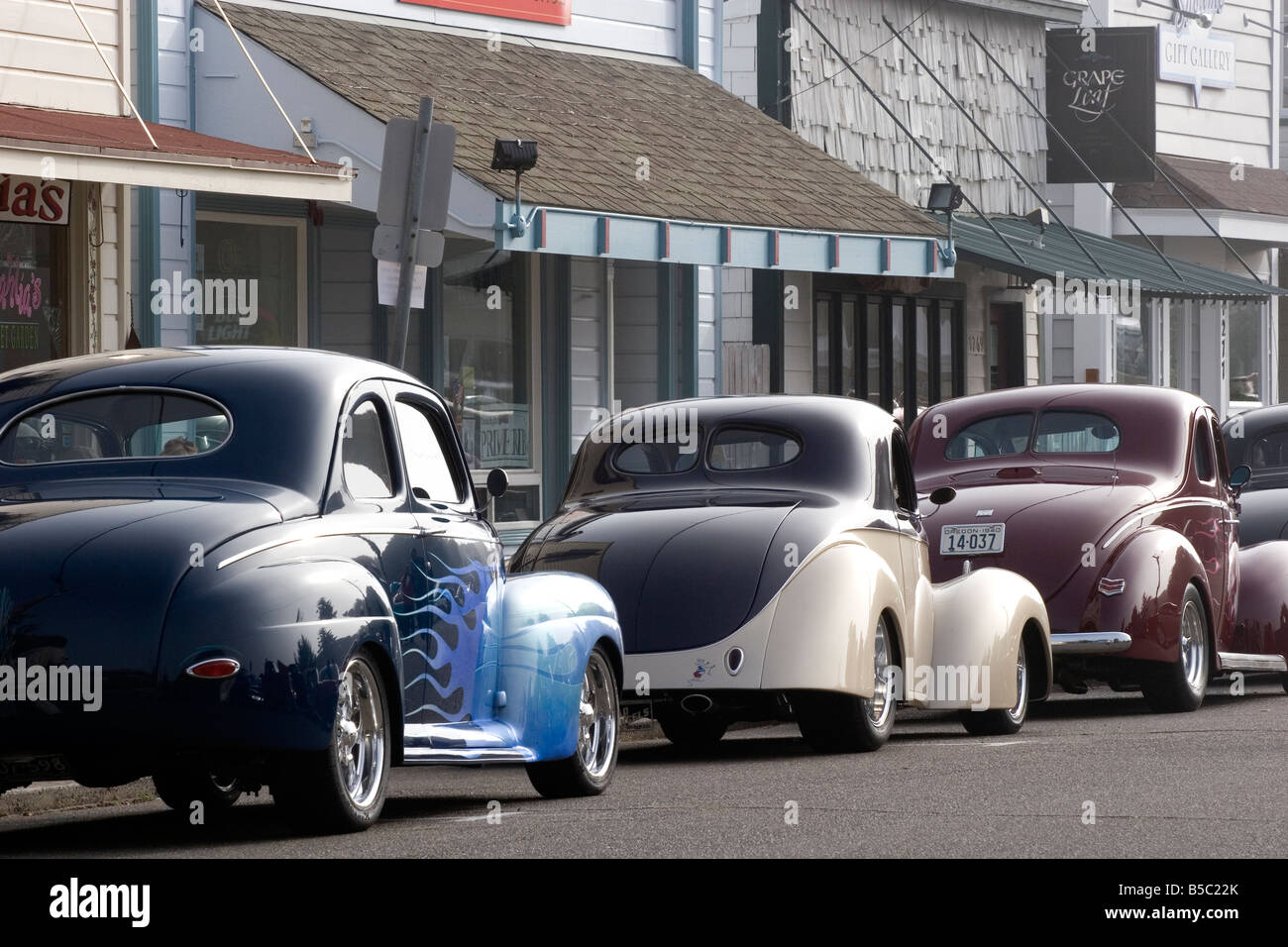 Antique cars lined up on the main street in Florence Oregon Stock Photo