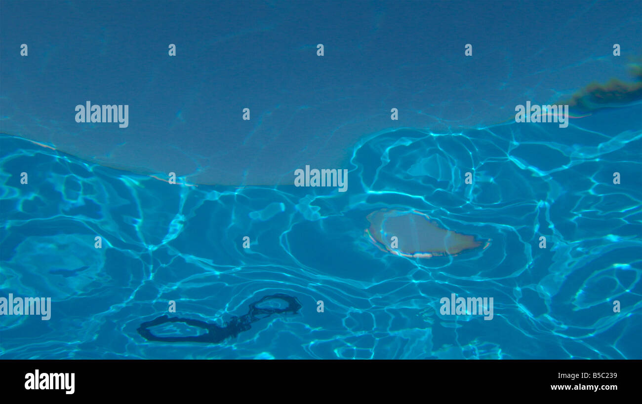 Abstract images of the water ripples on surface in a swimming pool ...