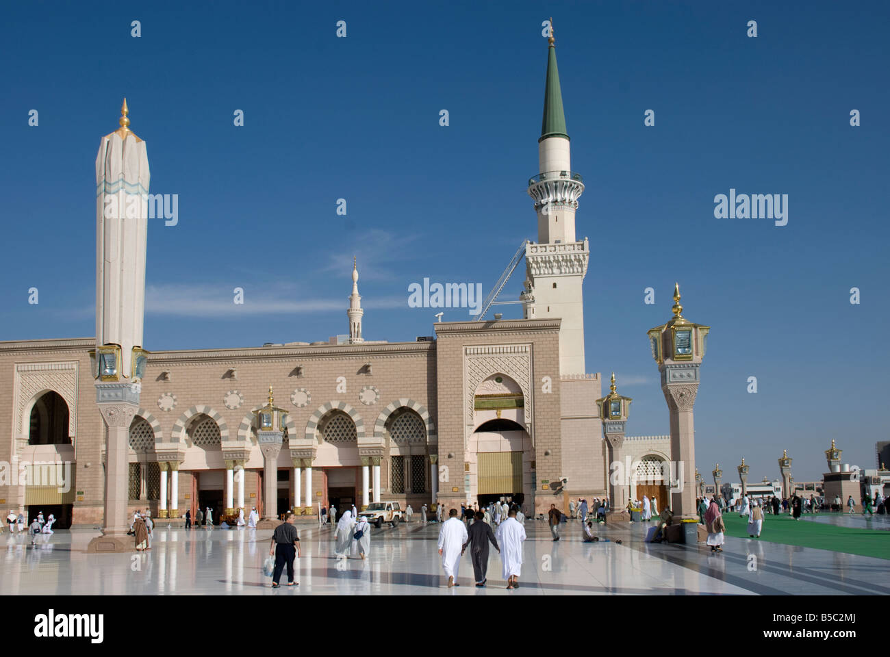 The old Ottoman part of Masjid al Nabawi in Madinah with an old minaret and folded shade umbrella on the left Saudi Arabia Stock Photo