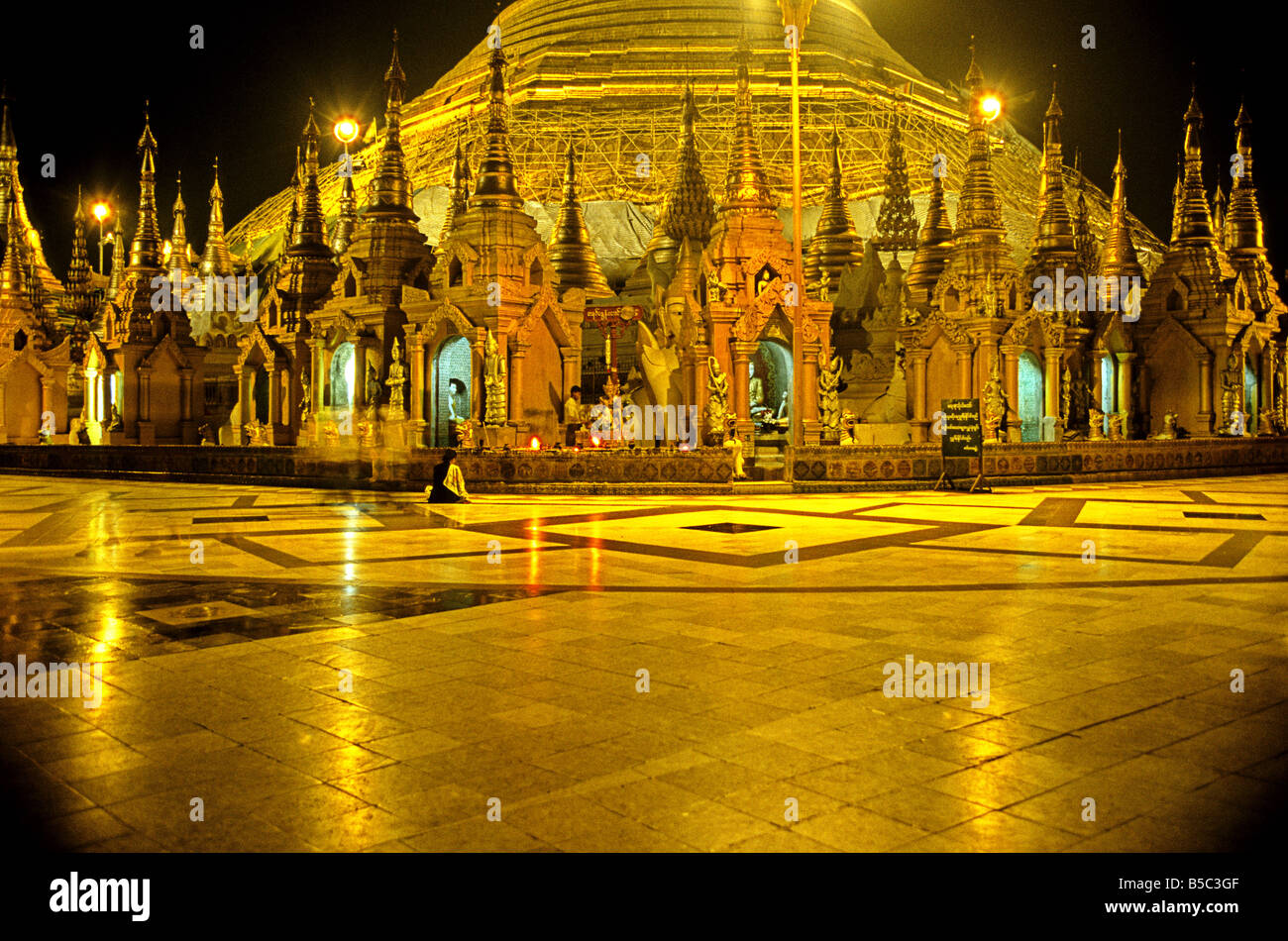 Small Buddhist shrines at the base of the Schwedagon Pagoda Rangoon Burma Myanmar Stock Photo