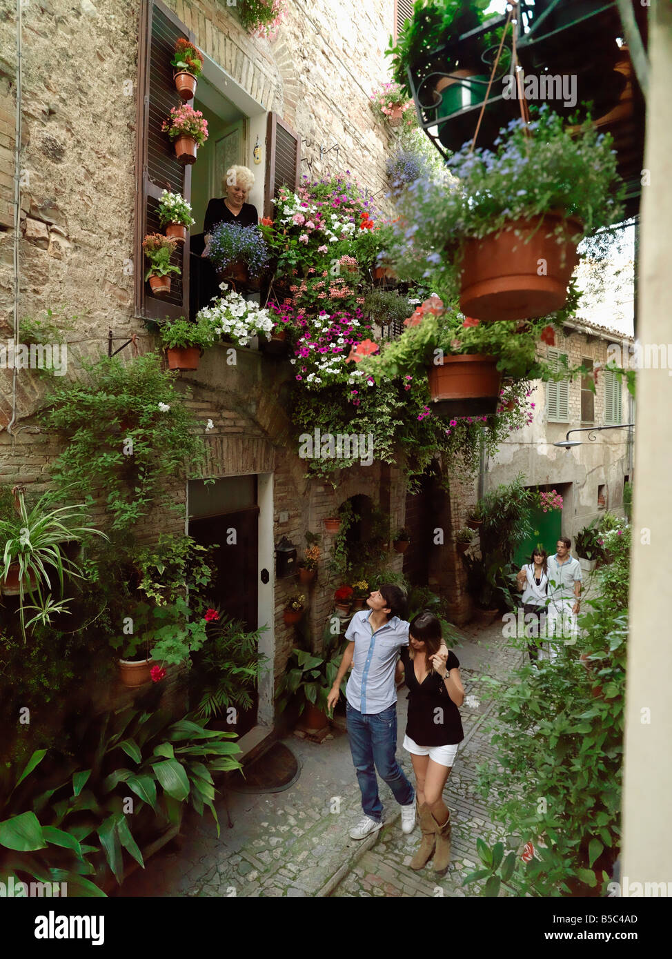 Young couples taking a leisurely stroll in Spello, Italy. Stock Photo