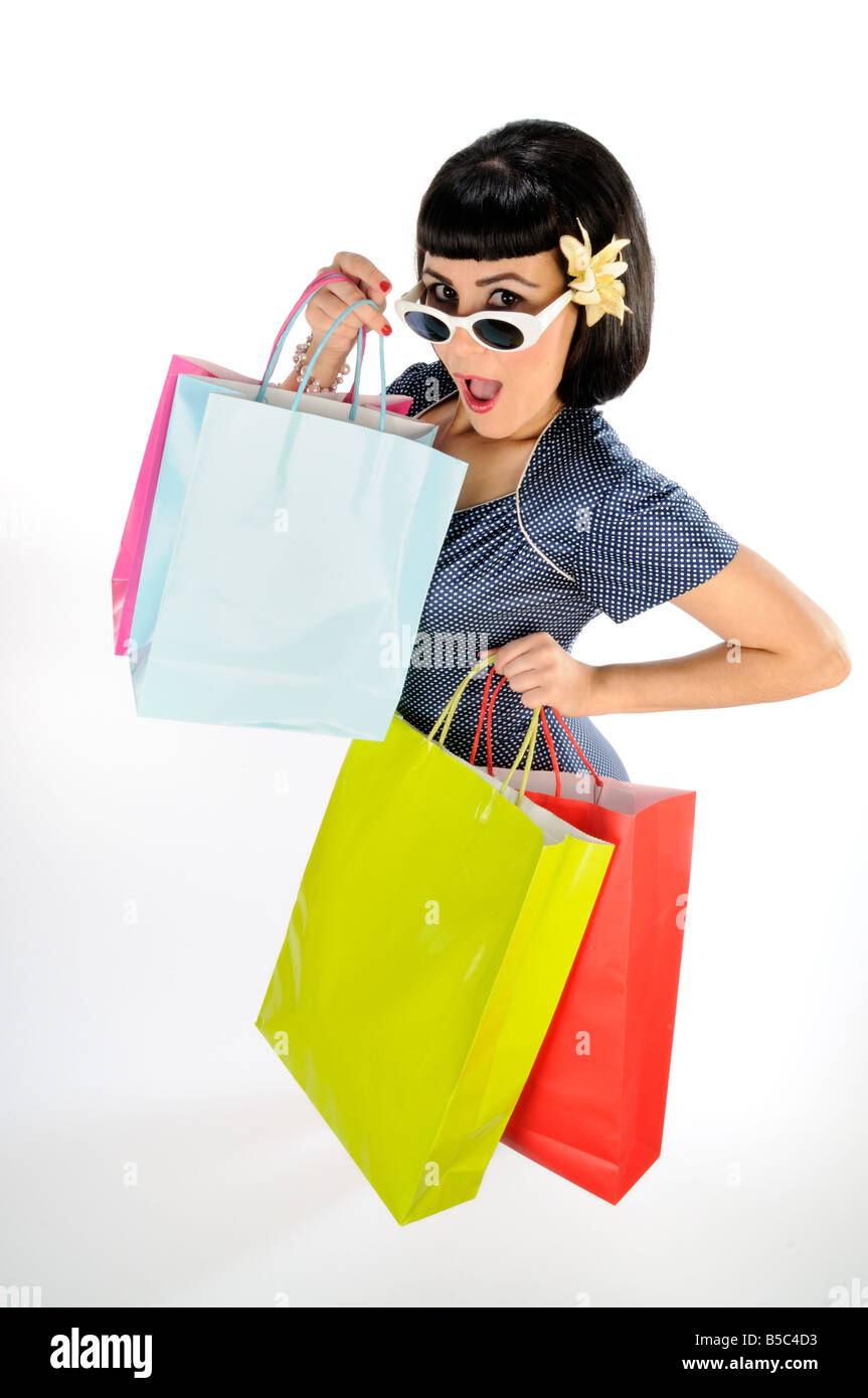 Young girl wearing sunglasses with shopping bags Stock Photo