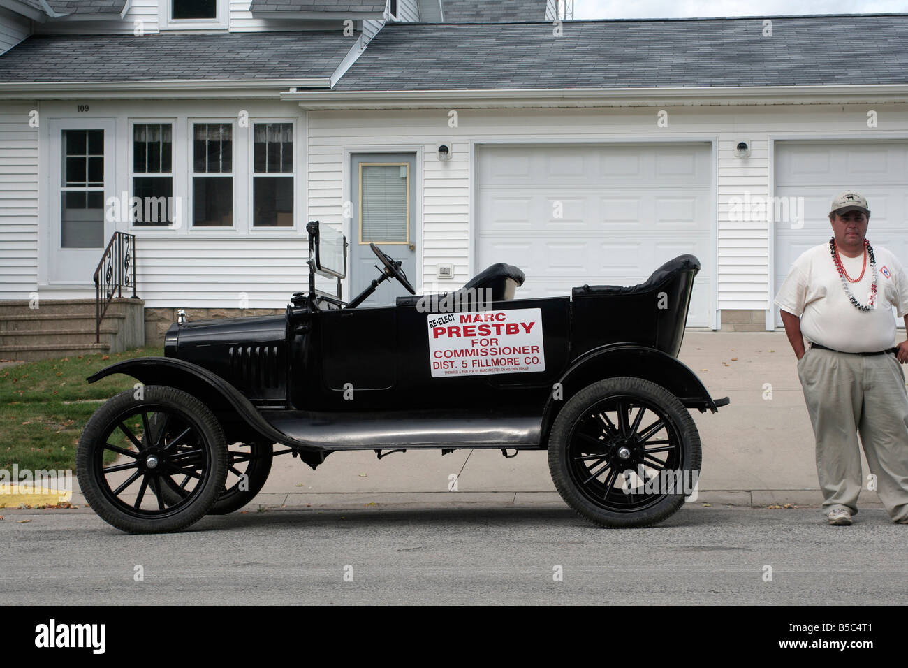 Local politician campaigning with old vehicle Stock Photo