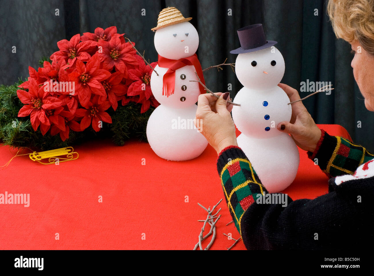Making snowmen with craft foam balls Stock Photo