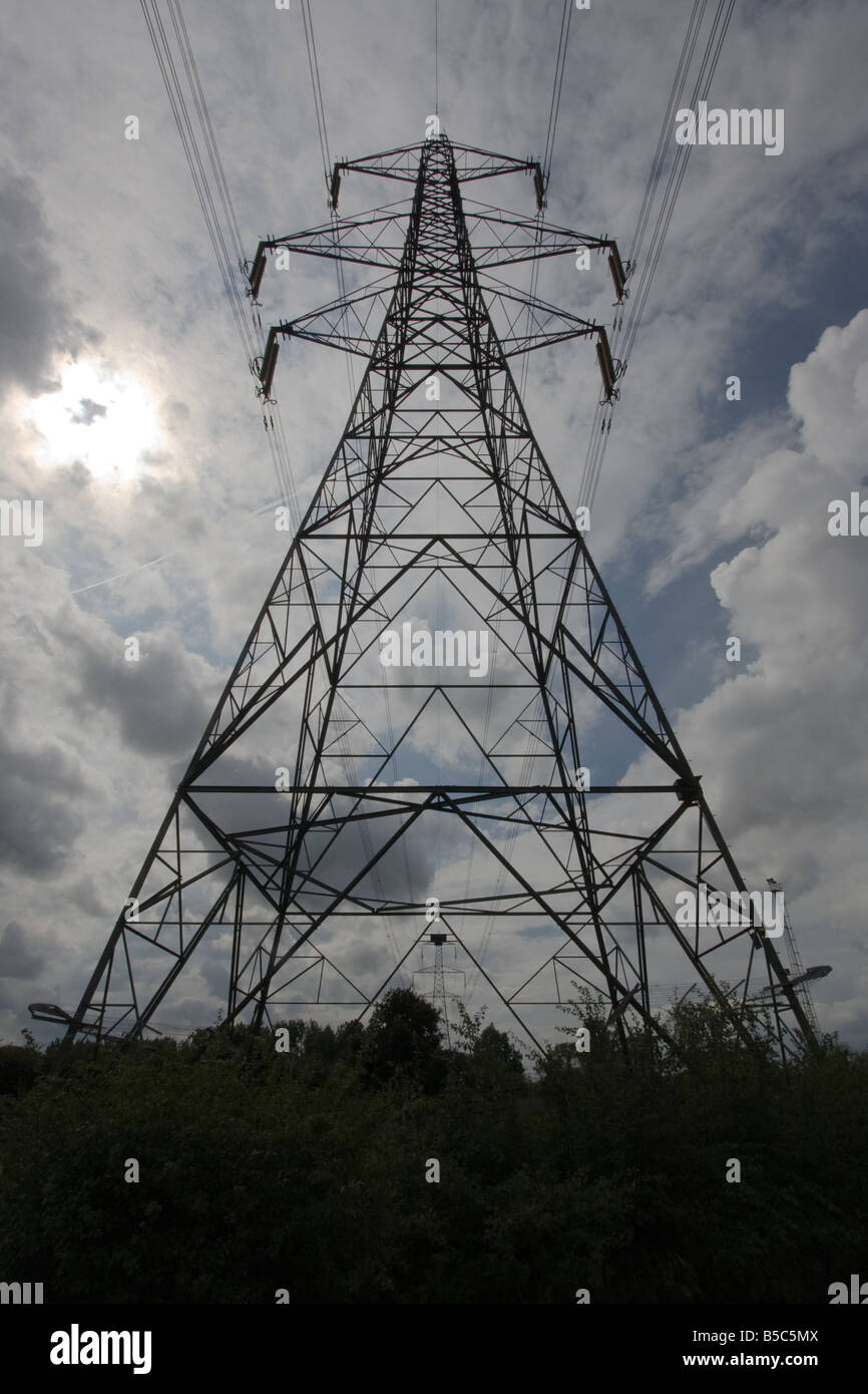 UK Electricity Pylon, silhouetted against a cloudy sky Stock Photo - Alamy