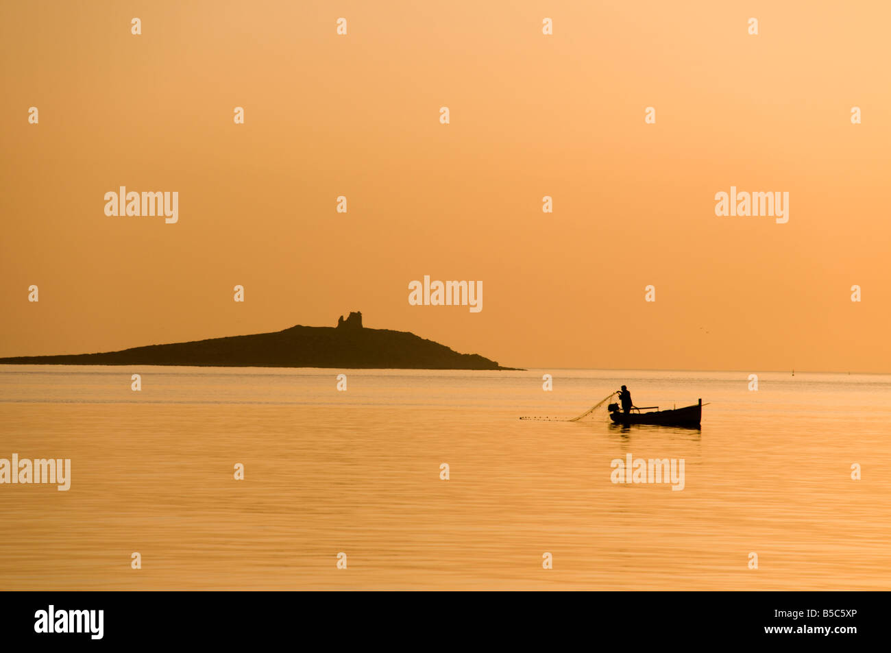The fisherman at the sunset Stock Photo - Alamy