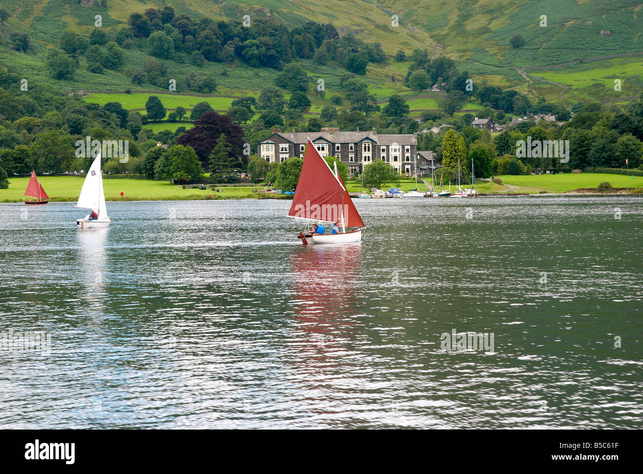 Sailing dinghy on Ullswater in the English Lake District, Cumbria Stock