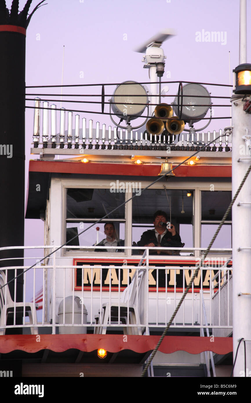 The captain on the microphone on the Mark Twain Steam Paddle Ship on the Mississippi River Hannibal Missouri Stock Photo