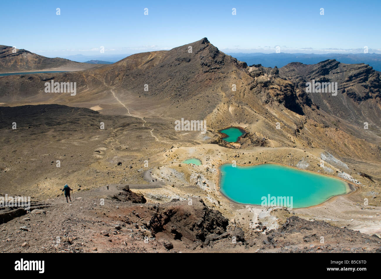 Hikers descending to the Emerald Lakes, Tongariro Crossing, North Island, New Zealand Stock Photo