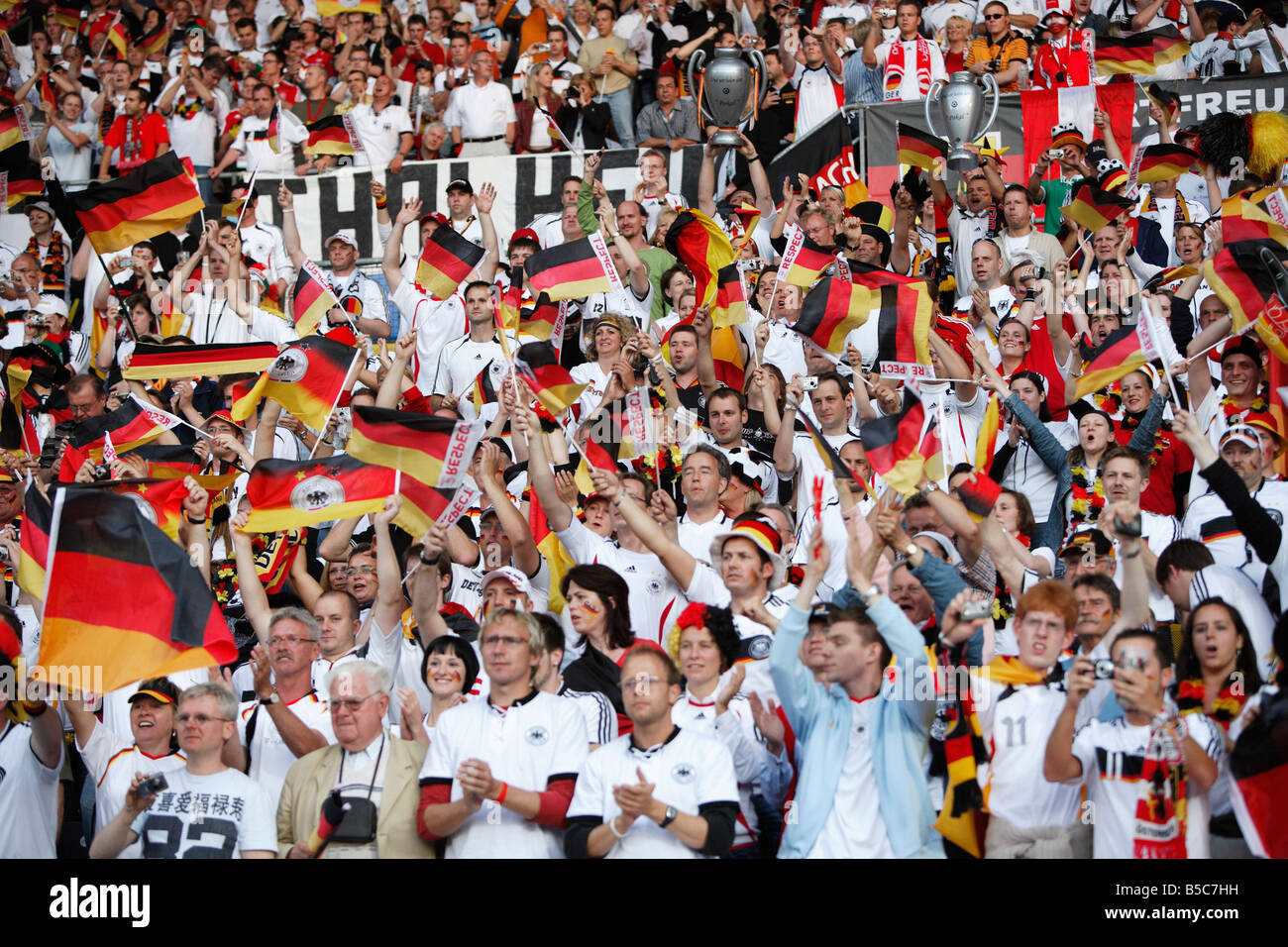 German supporters cheer their team prior to the start of a UEFA Euro 2008 group stage match against Austria. Stock Photo