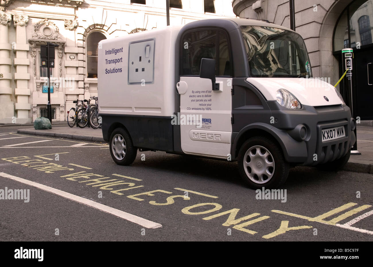 Electric Delivery van on charge in London street at Juice piont Stock