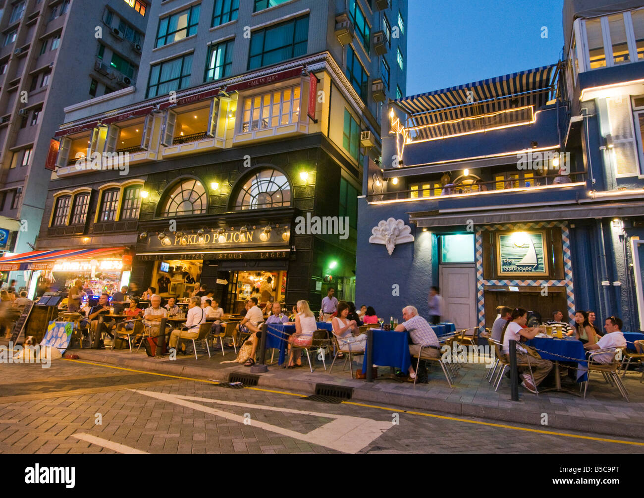 "Tourists and residents of Hong Kong at the popular alfresco waterfront