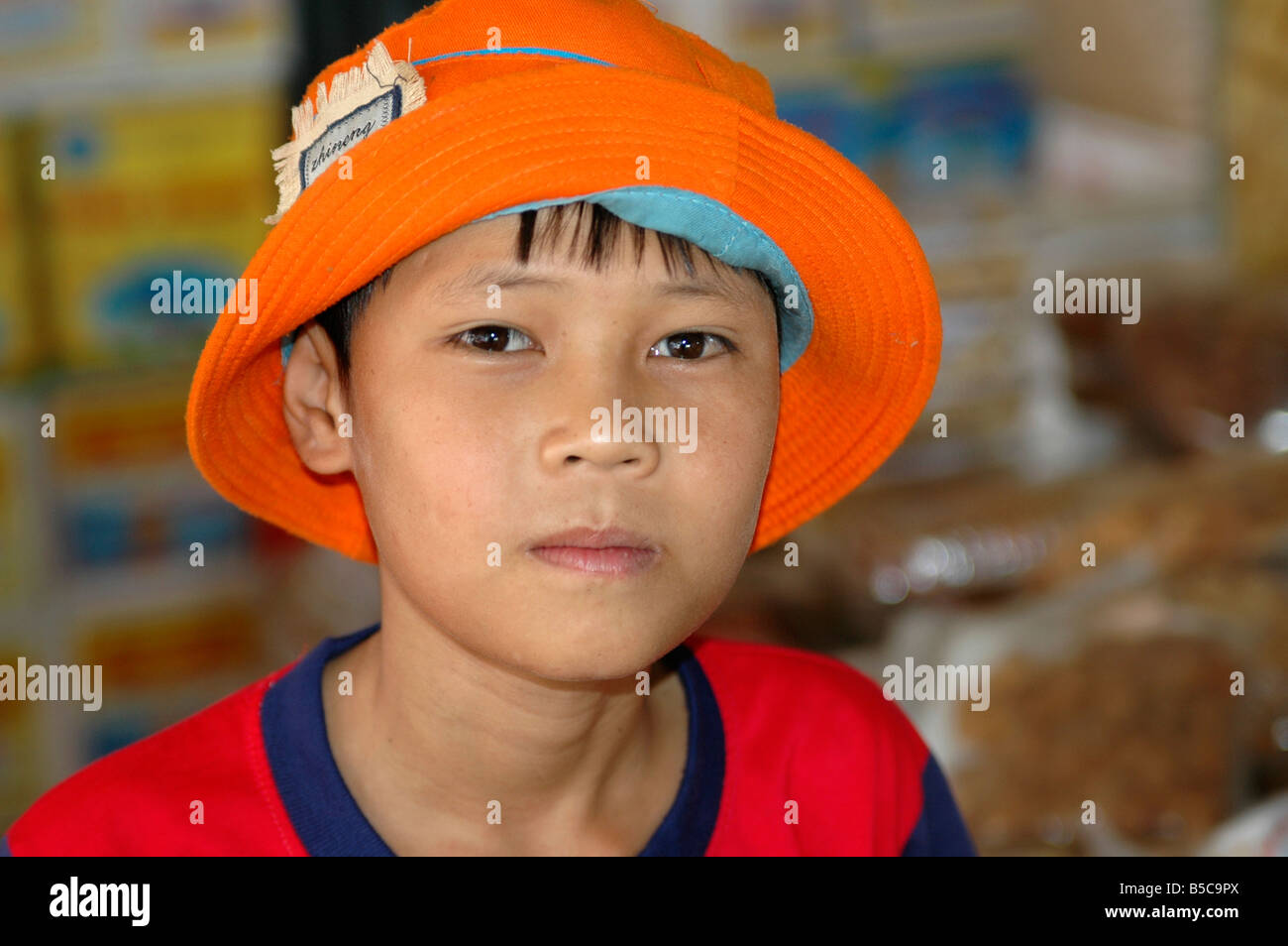 Portrait of a 11 year old boy with red hat Phan Thiet, Viet Nam Stock ...