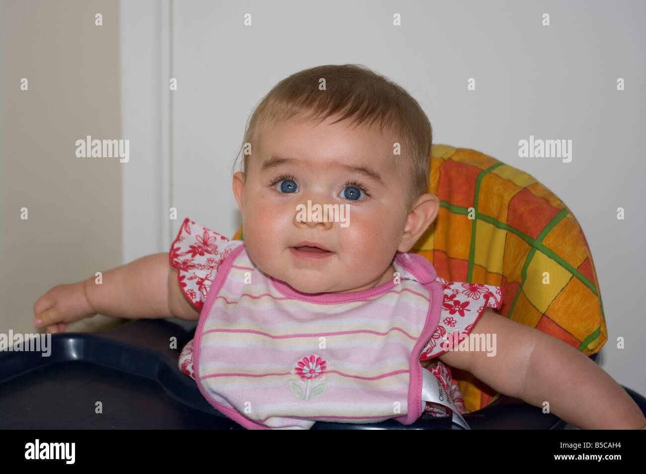 Baby Girl Child With Blue Eyes Smiling Stock Photo