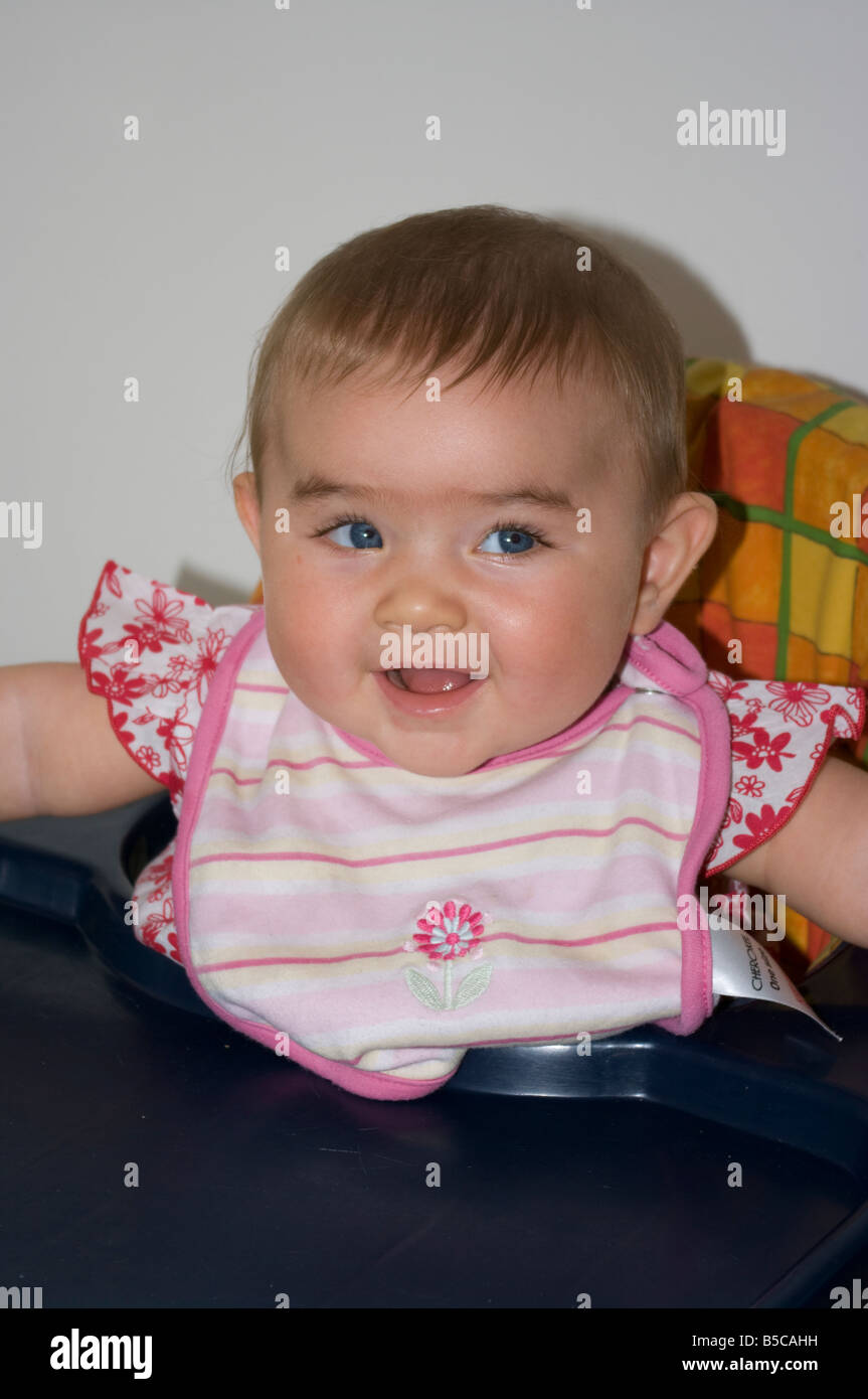 Baby Girl Child With Blue Eyes Smiling and Laughing Stock Photo