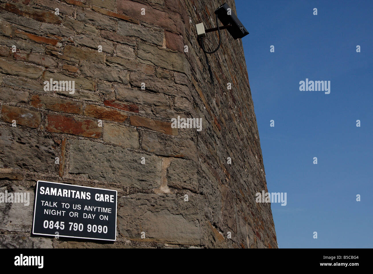 Samaritans sign and [CCTV camera] on tower of [Clifton Suspension Bridge], Bristol, England, UK Stock Photo