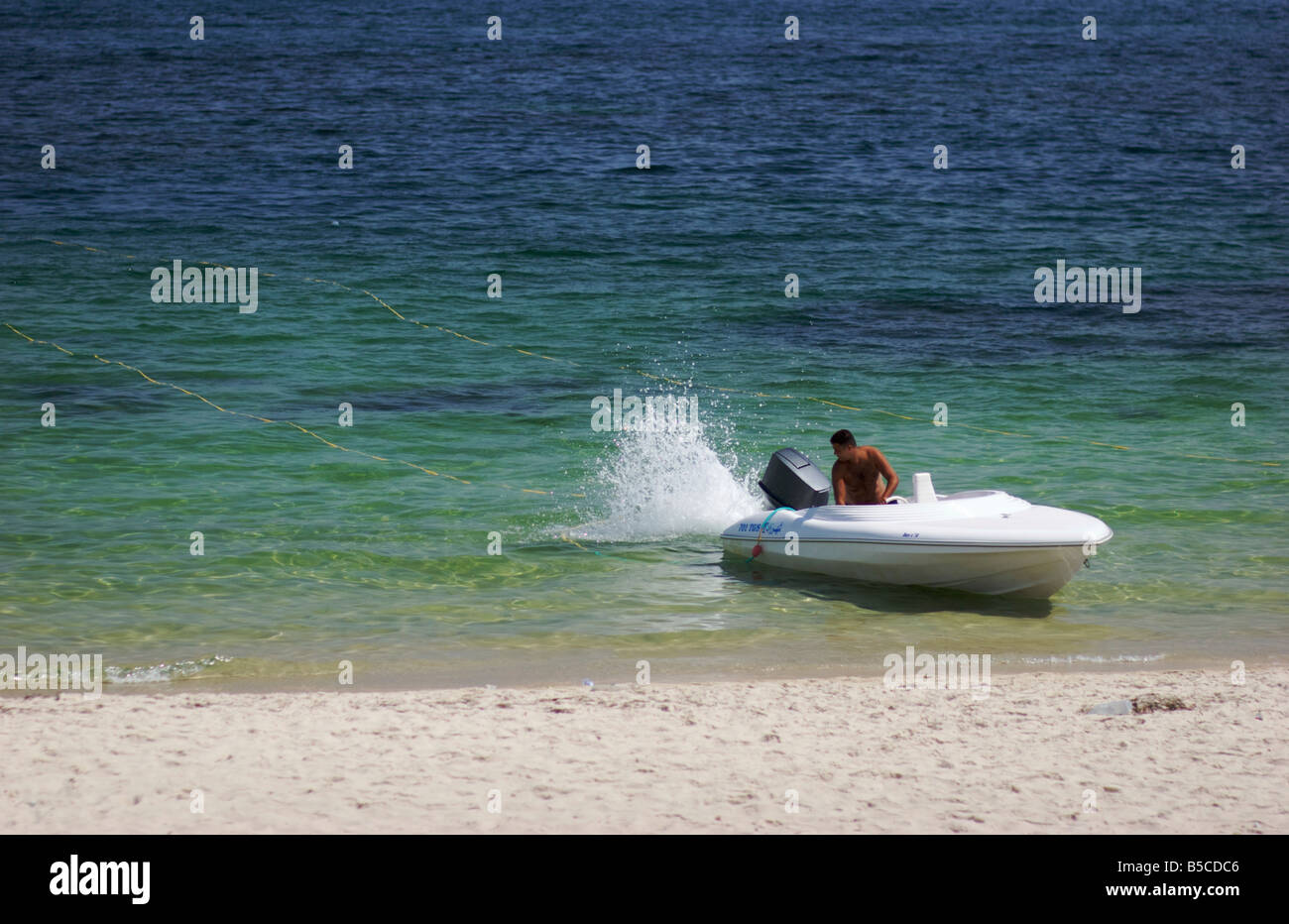 A motorboat with an outboard motor hires stock photography and images