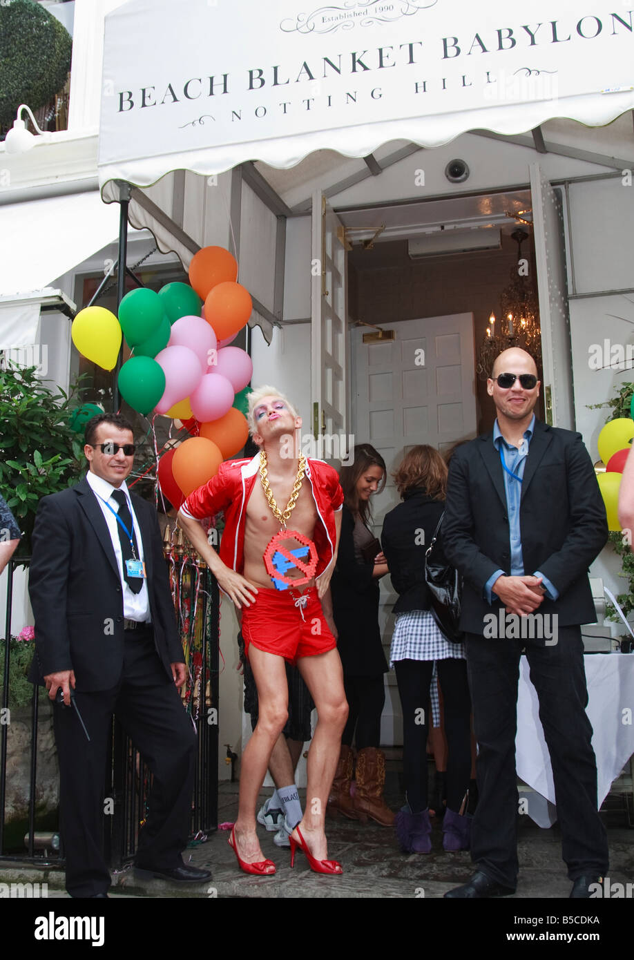 flamboyant guest and bouncers at carnival Party at Beach Blanket