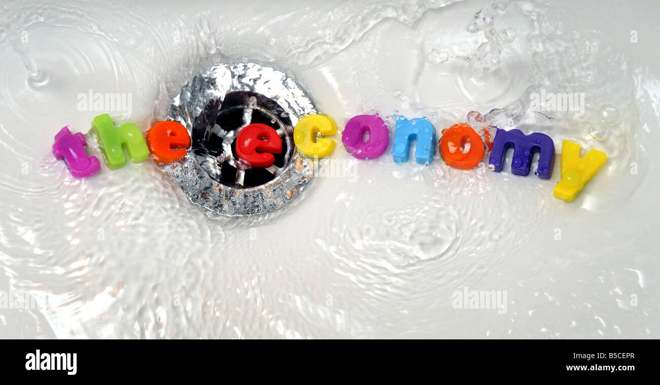 "THE ECONOMY" WASHED DOWN THE PLUGHOLE..... Stock Photo