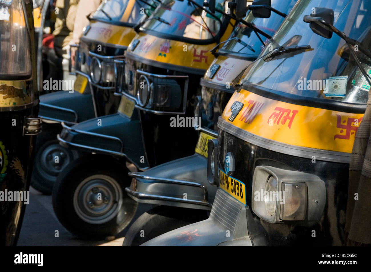 Row of traditional Indian rickshaw taxis Stock Photo