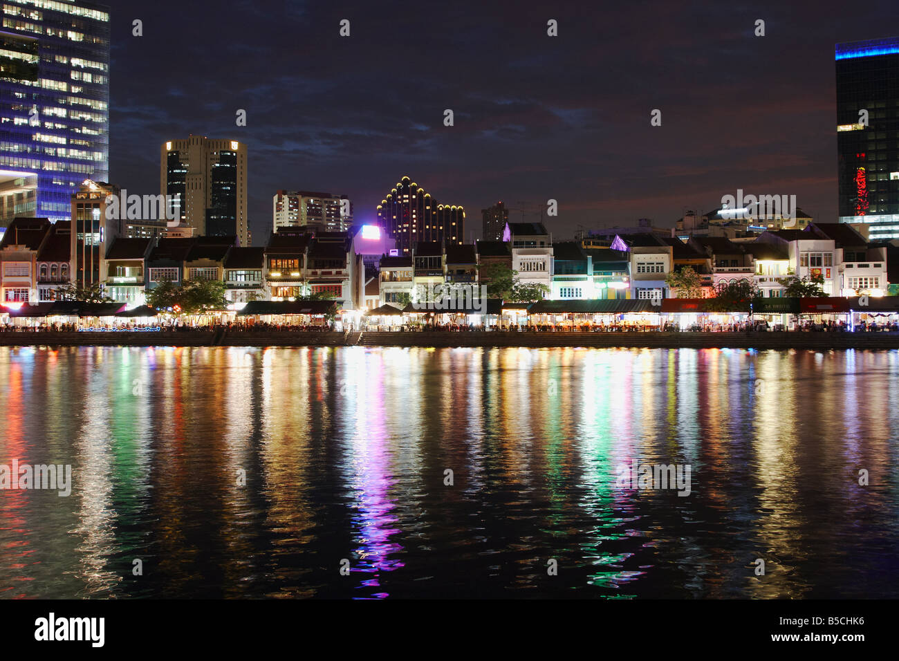 Restaurants Along Singapore River In Central Business District At Dusk Stock Photo