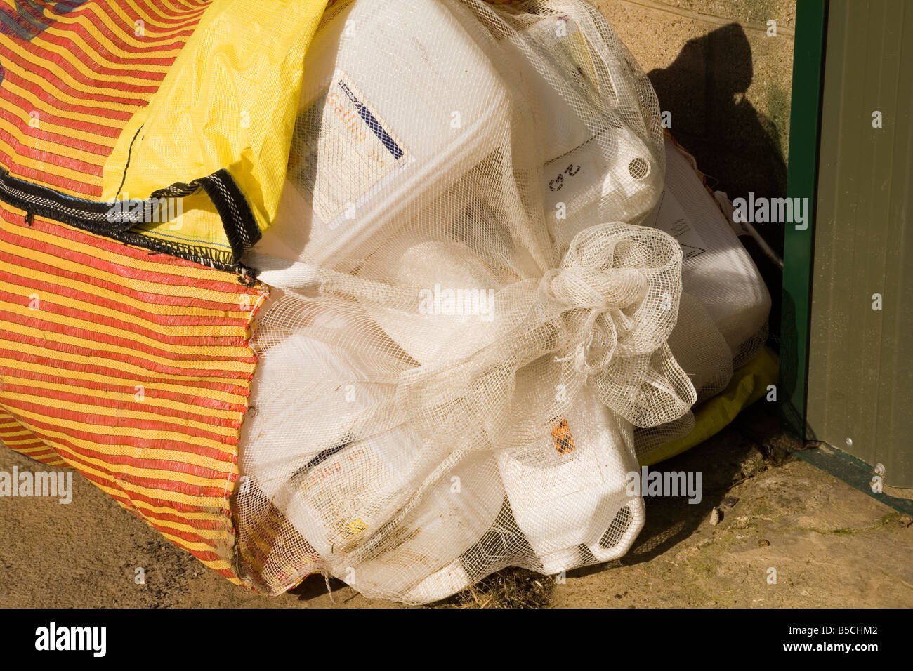 Waste Spray containers bundled into a net ready for collection Stock Photo