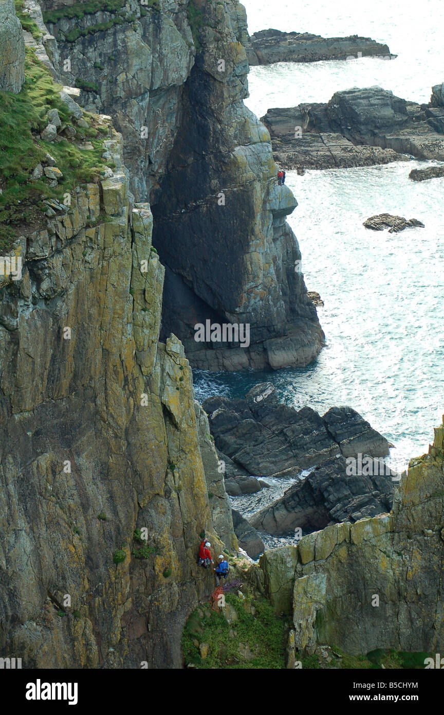 Rock climbers on cliff of South Stack, on Anglesey in Wales England UK Stock Photo