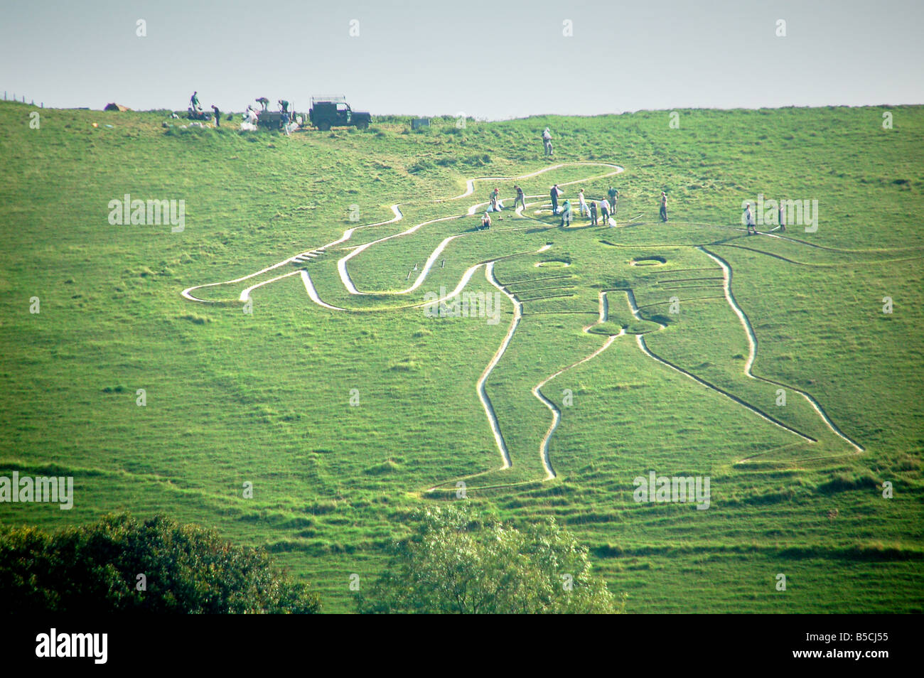 Re-chalking the Cerne Giant in September 2008 on Cerne Abbas in Dorset England UK Stock Photo