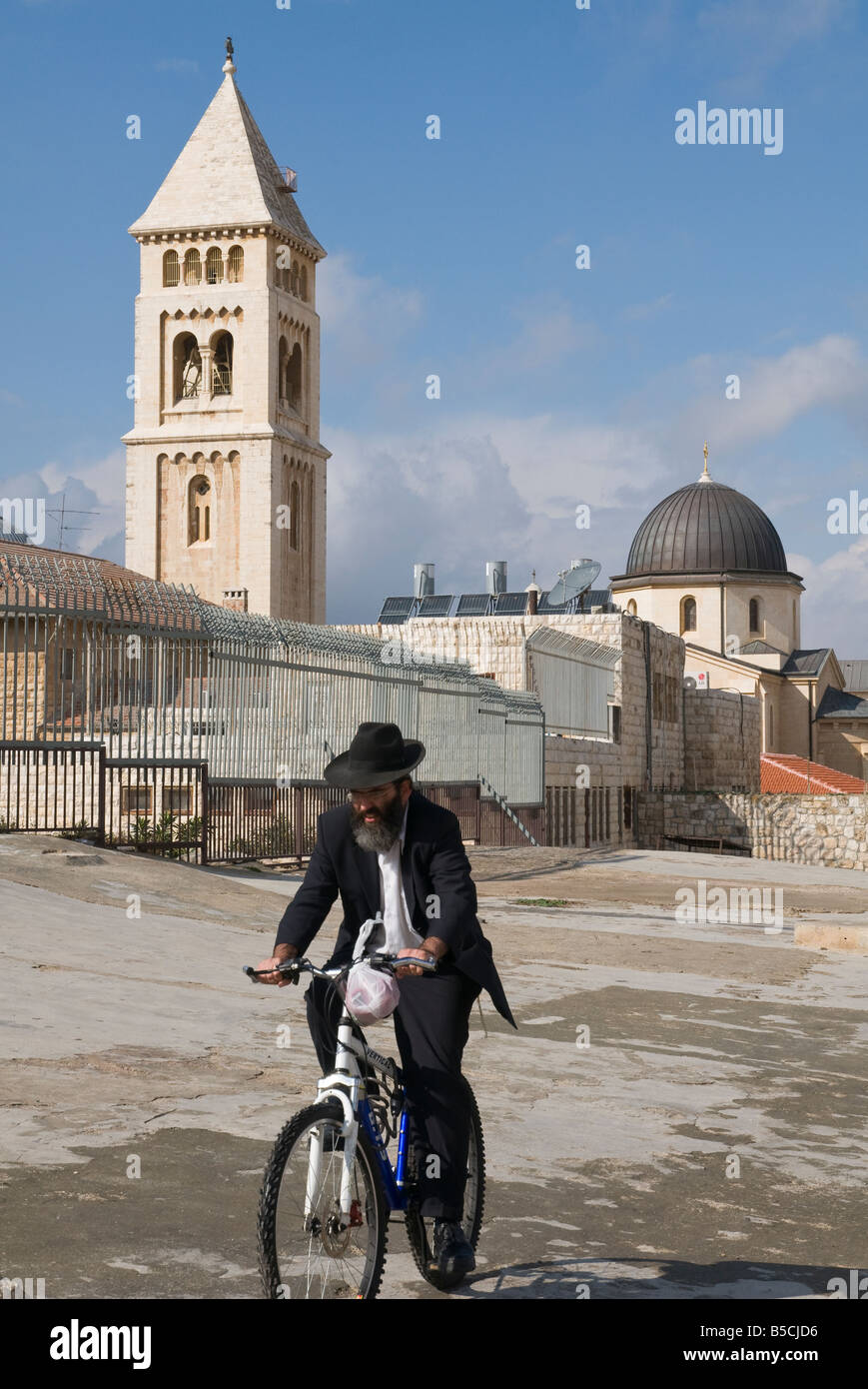Israel Jerusalem Old City orthodox jew riding a bicycle with redeemer ...