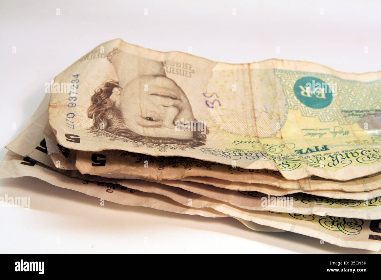 Old Five pound notes still in circulation some repaired with