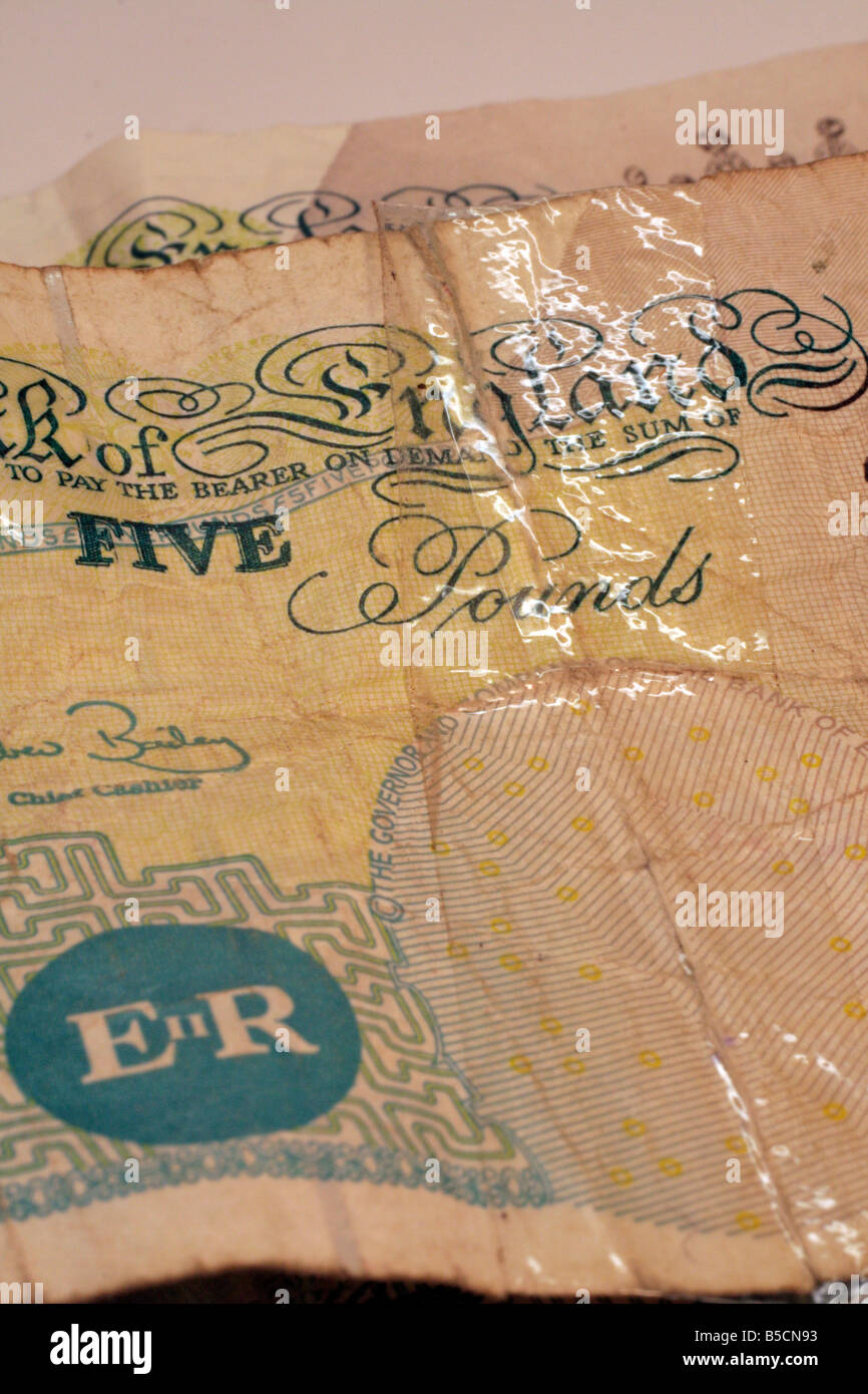 Old Five pound notes still in circulation some repaired with