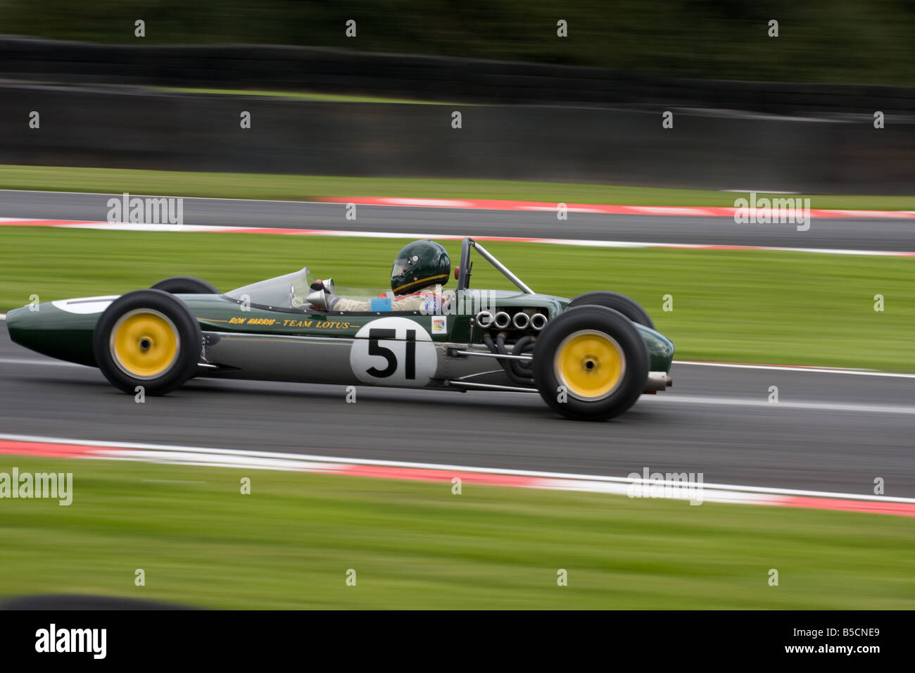 A close-up of a fast moving classic Lotus sports car. Stock Photo